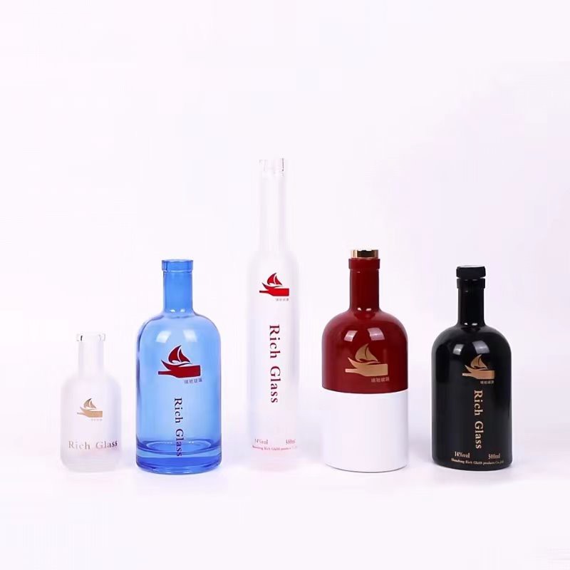 colored glass bottles with corks