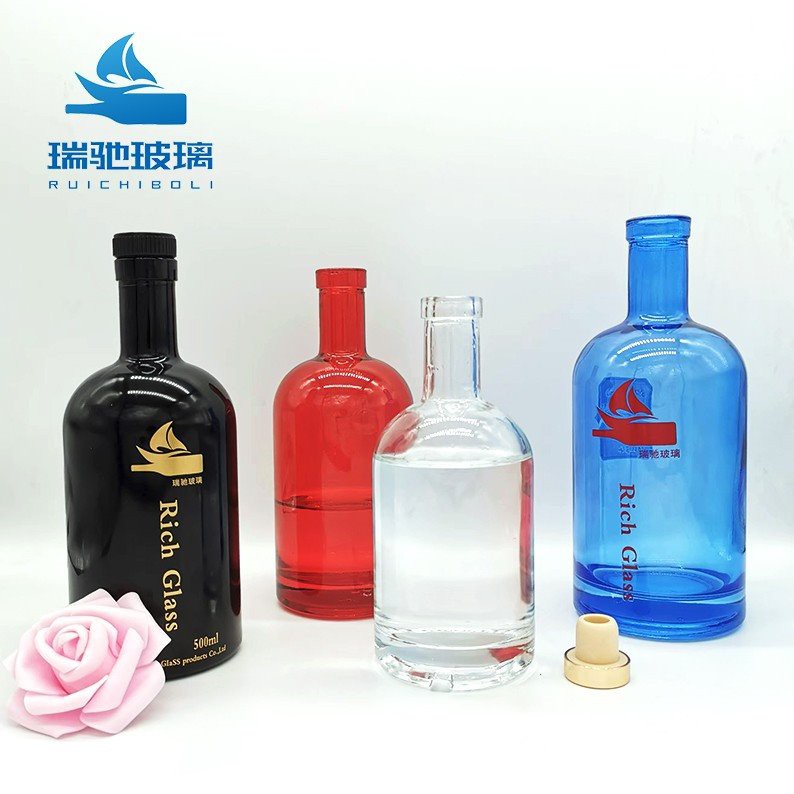 colored glass bottles with corks