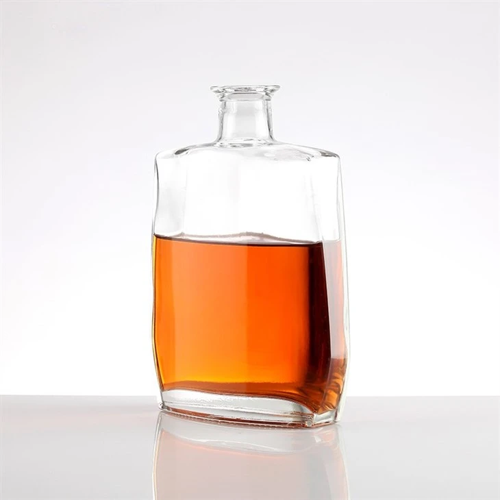 Simple Golden-Lidded Transparent Glass Bottle
